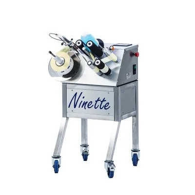 Étiqueteuse semi-automatique Ninette 1 CDA avec rouleaux d’étiquettes pour pots et bocaux de miel