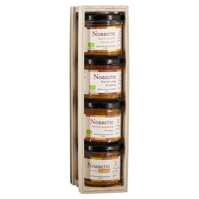 Coffret en bois de quatre nonnettes au miel : ganache chocolat-miel, crème de marron, marmelade d’orange et Caramiel.